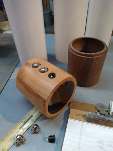 buttons inserted in cherry wood base