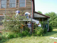 Handing the collectors up to the scaffold