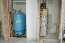 Pressure tank and water heater in closet