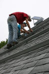 John R. (red shirt) and Guy up on the roof