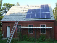 roof showing panels and 9 mor inverters