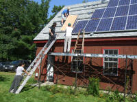 gatting covered panel into position on the roof