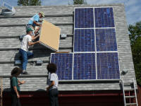 Crew installing solar panels